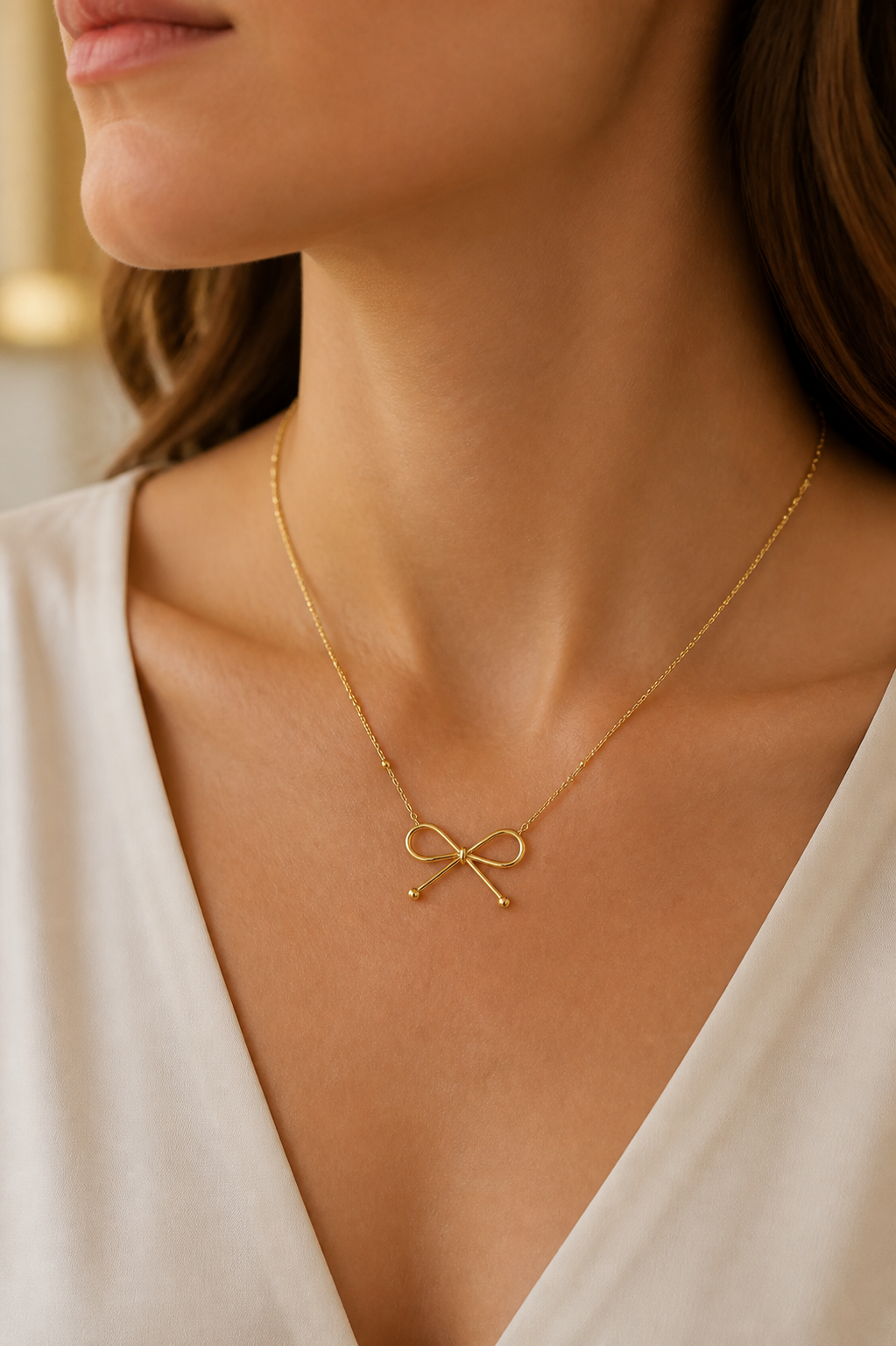 Nœud gold bow necklace — worn lifestyle view